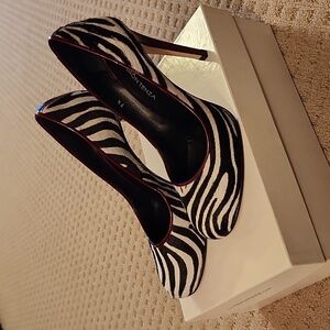 Zebra print, pony hair heels, adorned with red highlight stiletto heels.